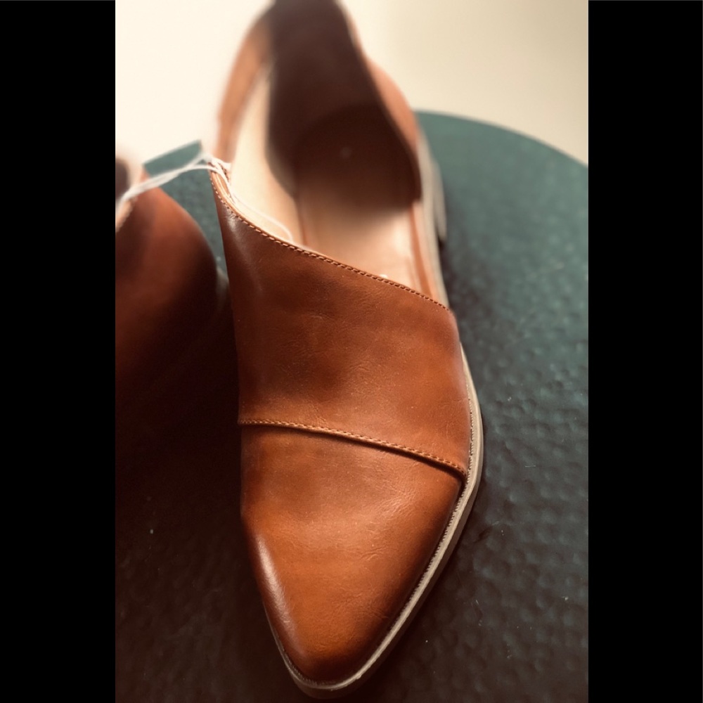 Asymmetrical, caramel colored loafer